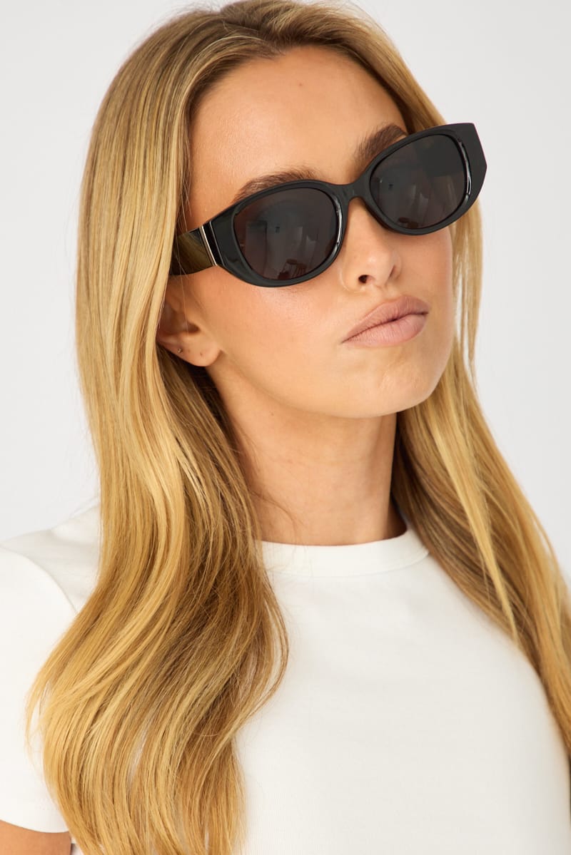 Ally Fashion glossy black fashion sunglasses with dark tinted lenses and upswept outer corners
