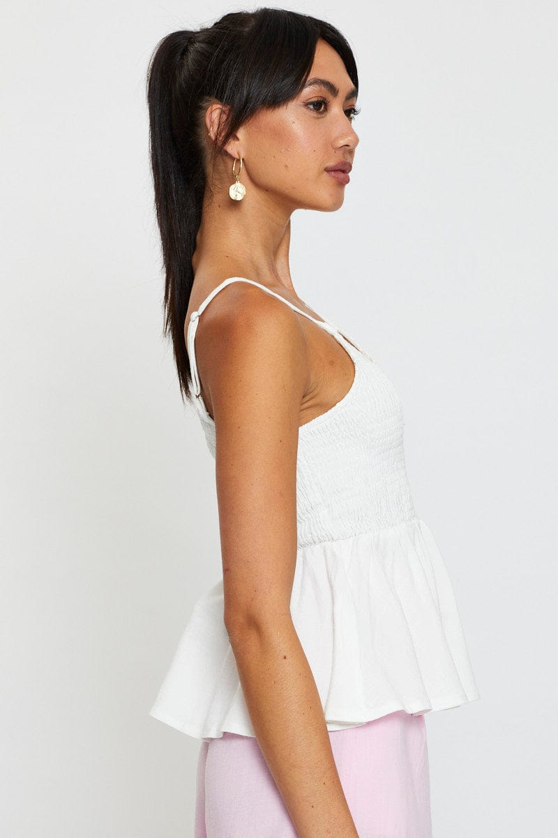 White peplum sales top sleeveless